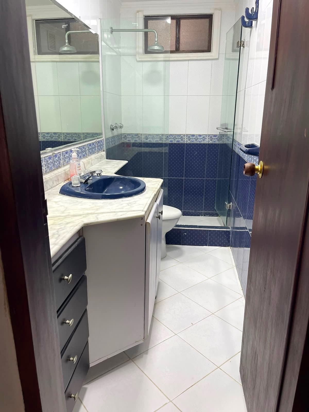 Bathroom with blue tile detail